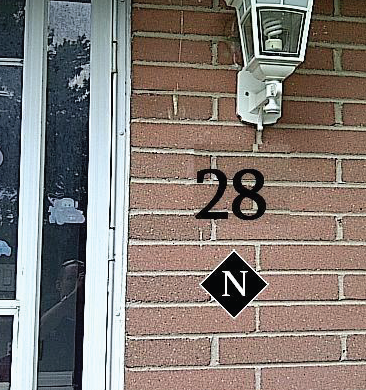 Door hanger depicting 28 with N plate