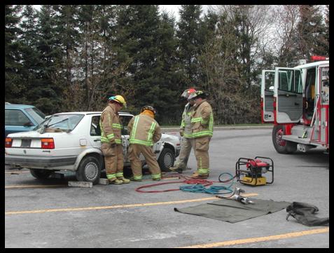 Firefighters tending to a vehicle 